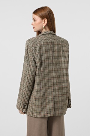 Бежевий двобортний жакет з вовни